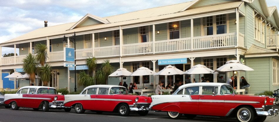 Classic cars parked outside The White Swan